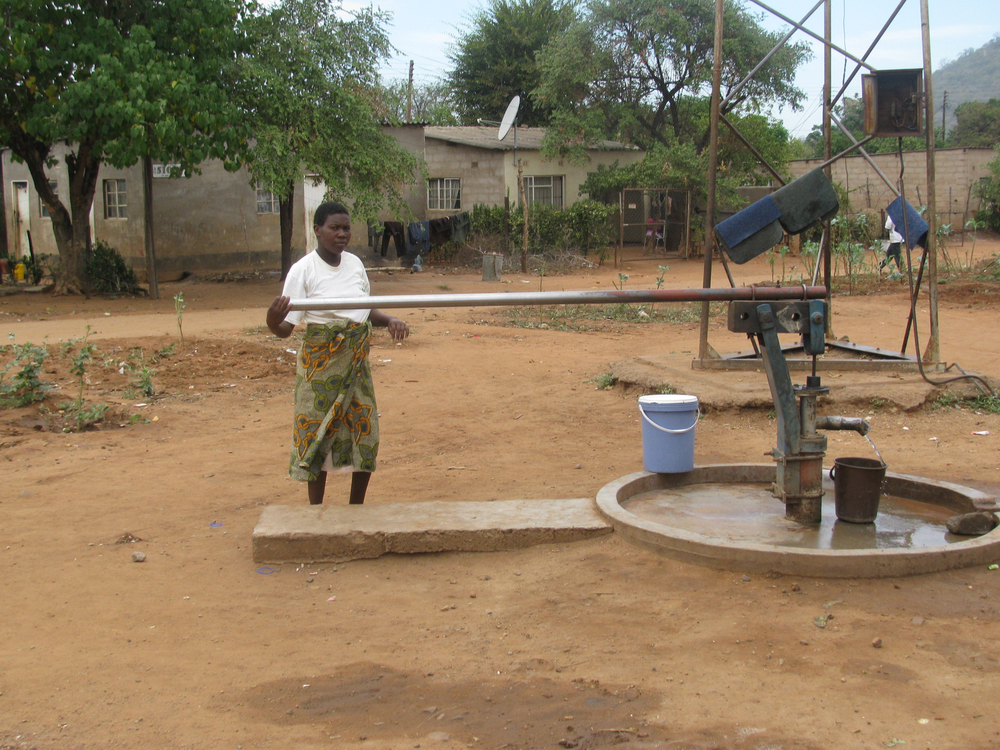 Due to the water crisis, Zimbabweans are forced to pump water from manual boreholes.